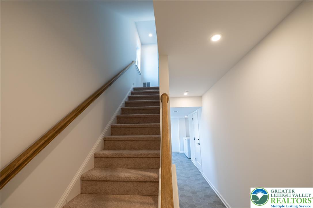 560 Long Street, Unit 1 Emmaus, PA 18049 - Photo 3 of 11 a view of staircase with white walls and white walls
