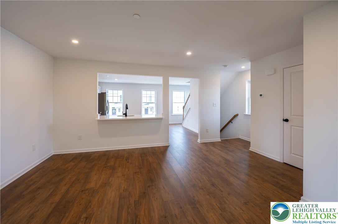 560 Long Street, Unit 1 Emmaus, PA 18049 - Photo 4 of 11 an empty room with wooden floor and windows