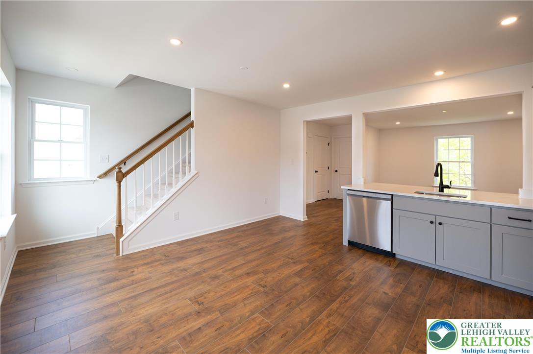 560 Long Street, Unit 1 Emmaus, PA 18049 - Photo 6 of 11 a view of an empty room with wooden floor and a window