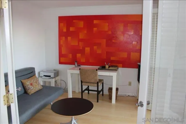 a living room with furniture and a lamp