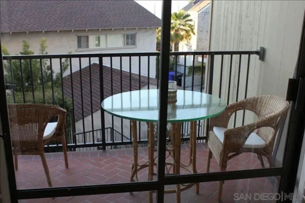 a view of a balcony with furniture