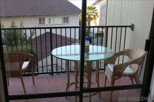 a view of a balcony with furniture