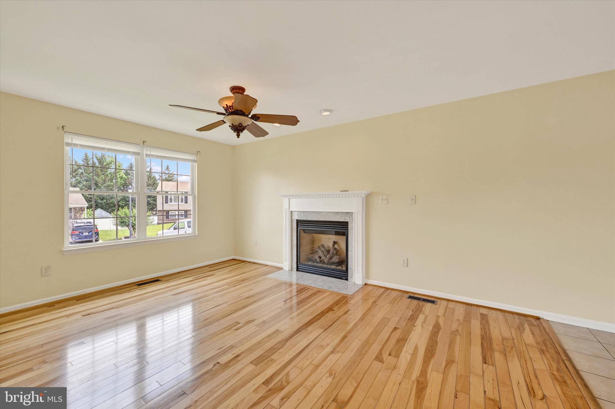 21 Box Circle Baltimore, MD 21221 - Photo 4 of 23 a view of empty room with a fireplace and wooden floor
