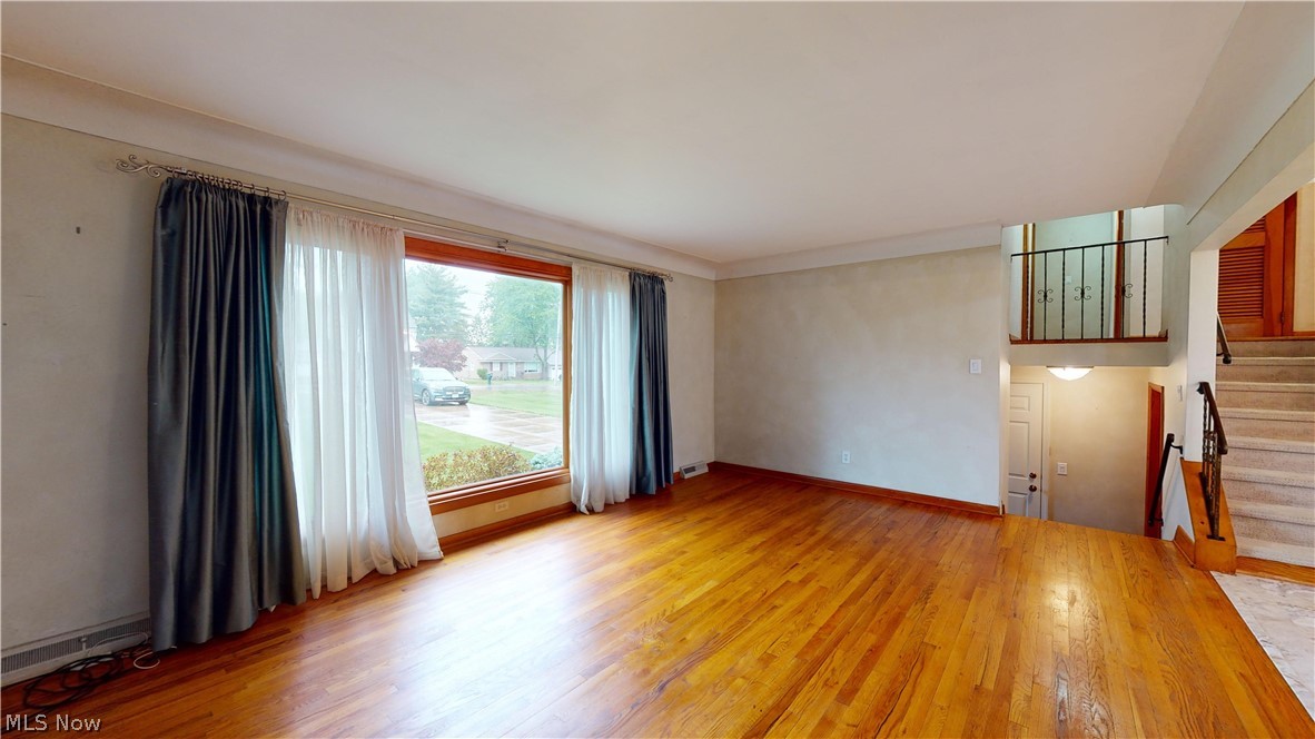6400 Brookside Road Independence, OH 44131 - Photo 29 of 47 Unfurnished living room featuring hardwood / wood-style floors