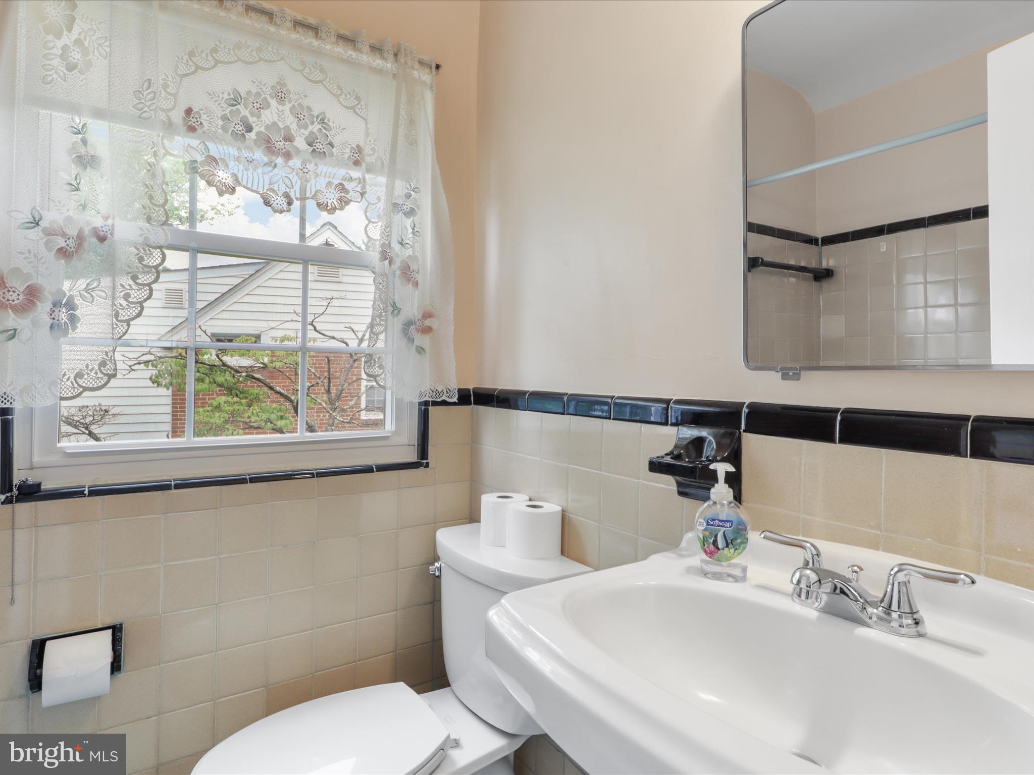 1808 Cody Drive Silver Spring, MD 20902 - Photo 19 of 41 a bathroom with a sink and a toilet