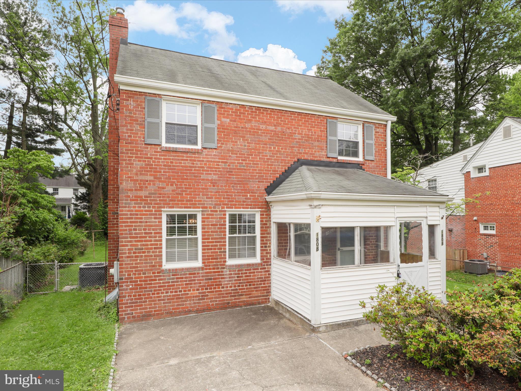 1808 Cody Drive Silver Spring, MD 20902 - Photo 2 of 41 a front view of a house with a garden
