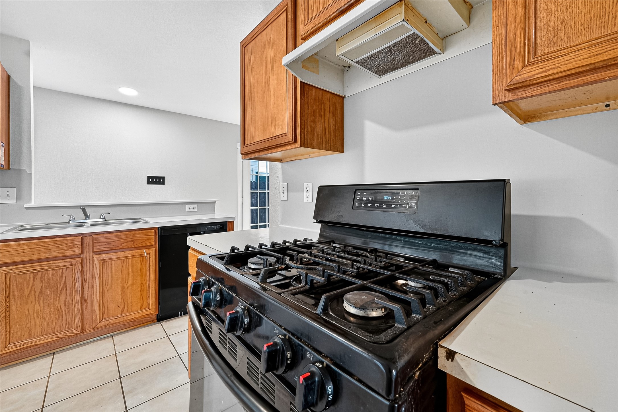 22819 Cabanna Road Spring, TX 77389 - Photo 10 of 26 a kitchen with stove and cabinets