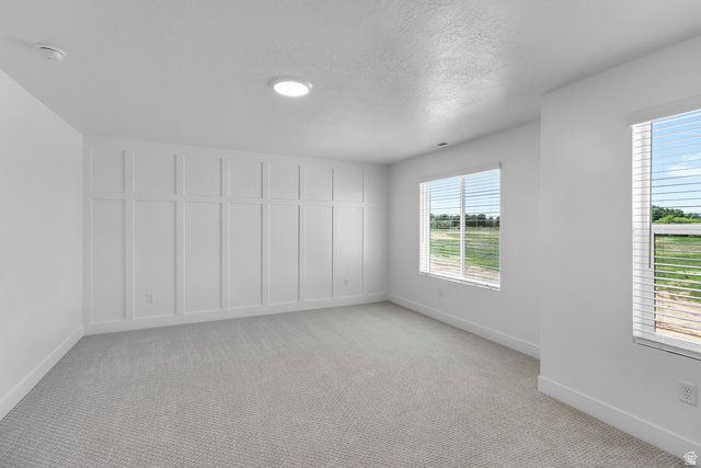 2770 West Aurora Avenue Mapleton, UT 84664 - Photo 6 of 16 Spare room with baseboards and light carpet