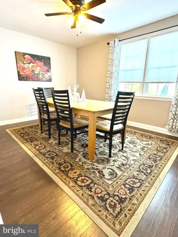 a kitchen with granite countertop a sink stove and cabinets