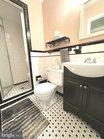 a view of a storage and utility room with washer and dryer