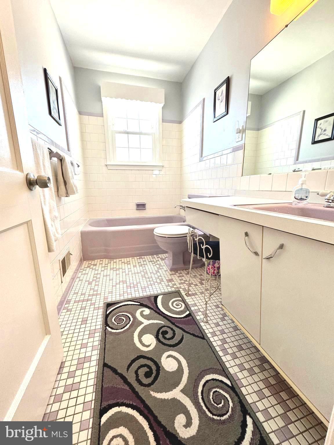 500 Milford Mill Road Pikesville, MD 21208 - Photo 15 of 43 a bathroom with a sink mirror and