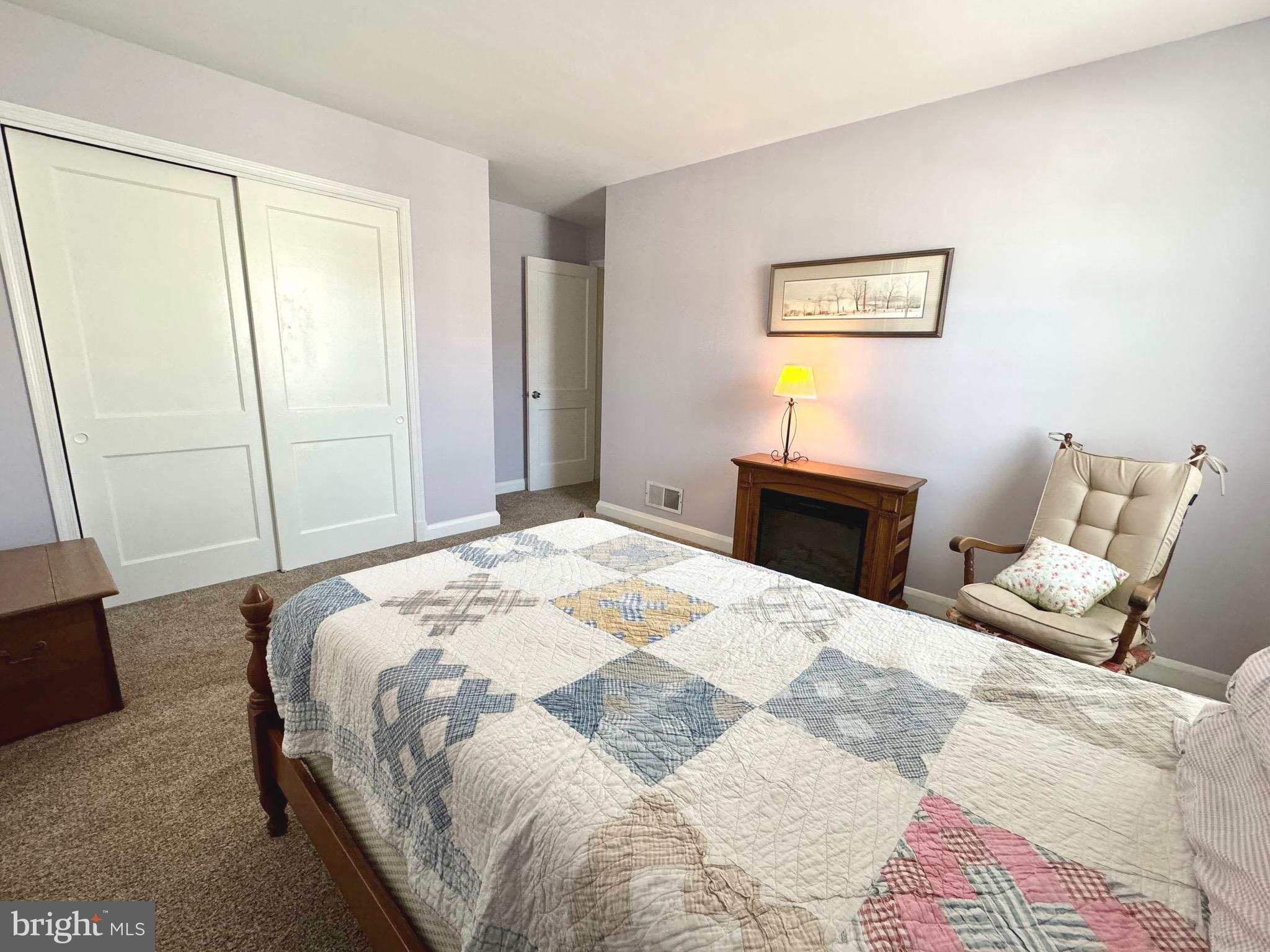 500 Milford Mill Road Pikesville, MD 21208 - Photo 19 of 43 a bedroom with a bed and wooden floor
