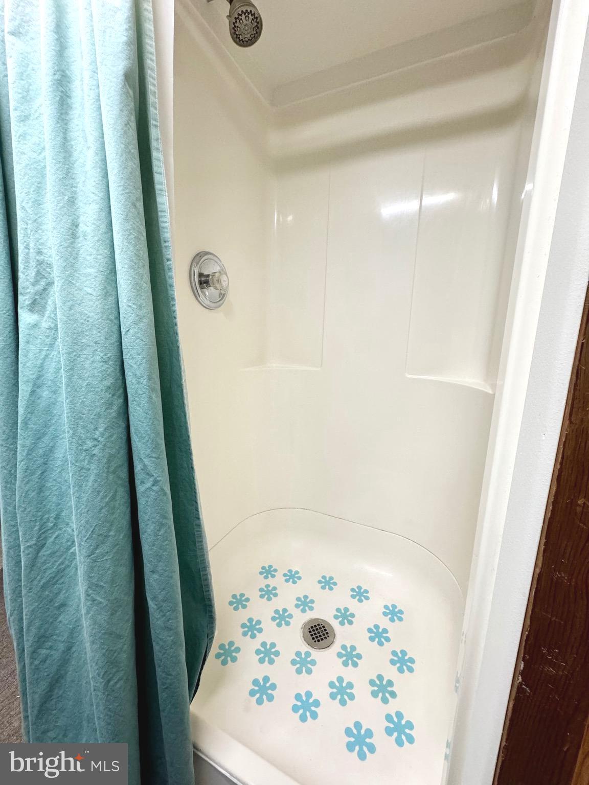 500 Milford Mill Road Pikesville, MD 21208 - Photo 27 of 43 a bathroom with a sink and a shower curtain