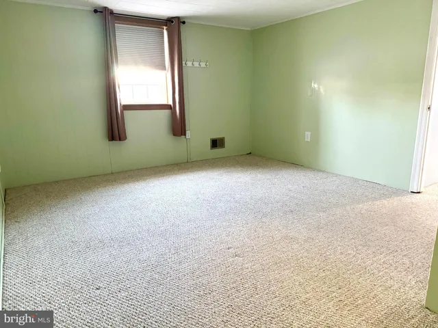 a dining room with furniture window and wooden floor