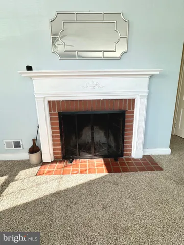 a living room with a fireplace