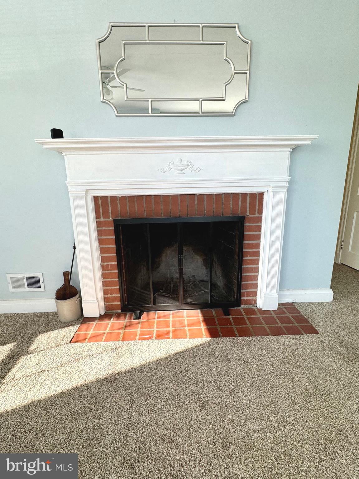 500 Milford Mill Road Pikesville, MD 21208 - Photo 4 of 43 a living room with a fireplace