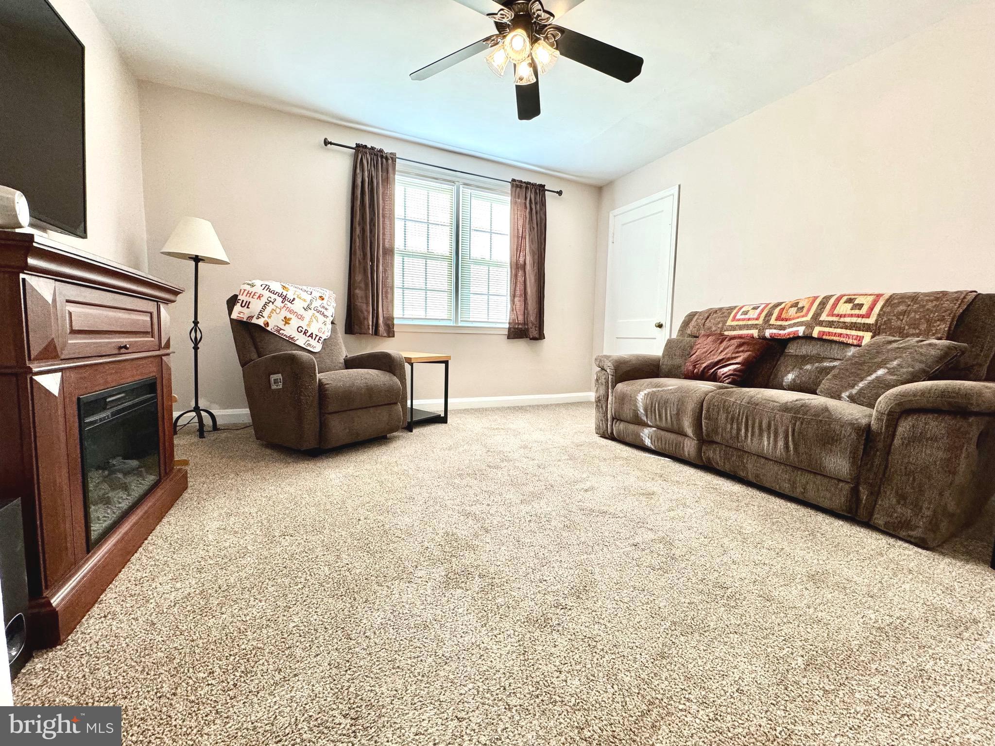 500 Milford Mill Road Pikesville, MD 21208 - Photo 8 of 43 a living room with furniture and a fireplace