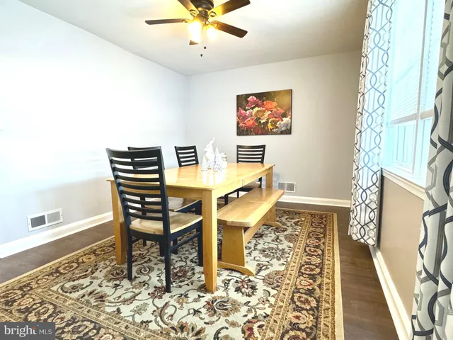 a view of a living room and dining room