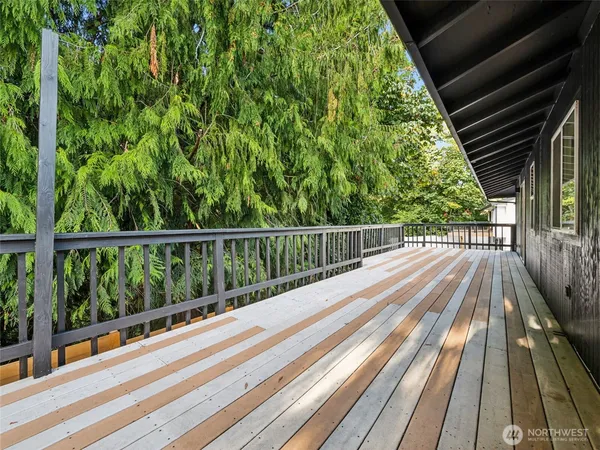 a view of balcony with wooden floor