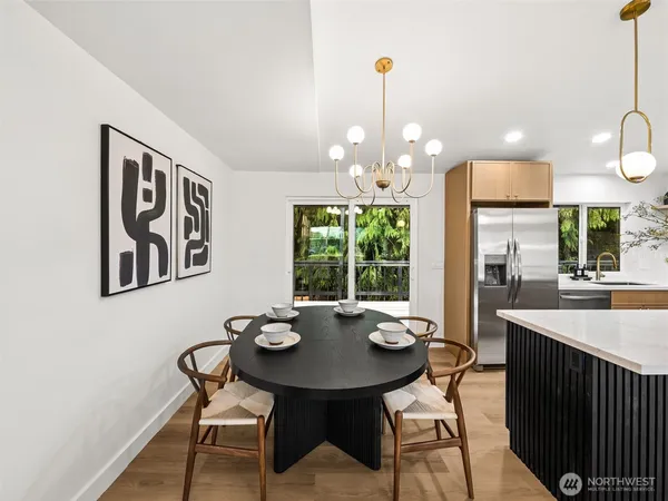 a view of a dining room and a table and chairs