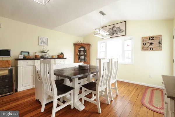 a living room with furniture a ceiling fan and a rug