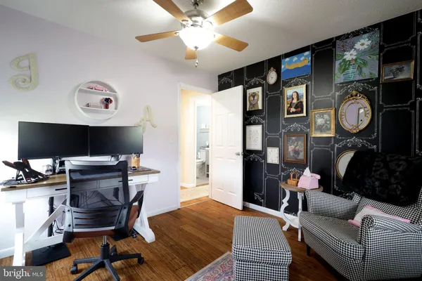 a bathroom with a sink mirror vanity and toilet