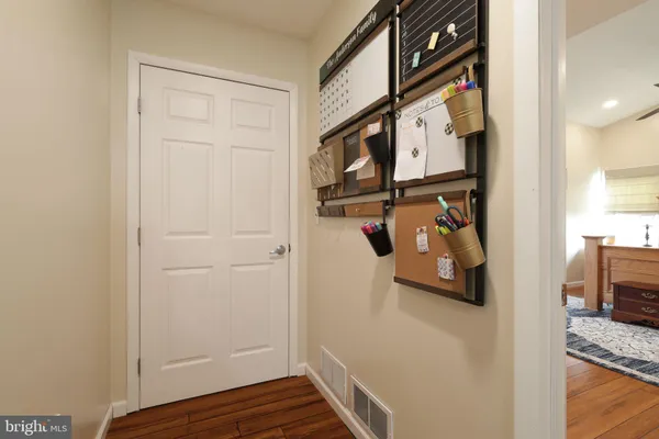 a view of workspace with wooden floor windows and windows