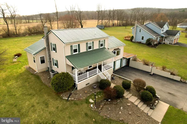 a kitchen with a refrigerator and a stove