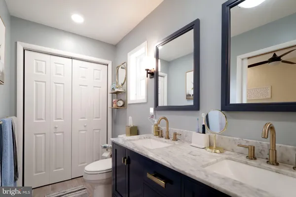 a view of house with a yard and deck