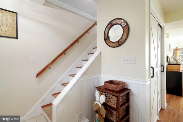 a view of a deck with mountain view and wooden floor