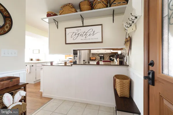 a kitchen with granite countertop a stove sink and microwave