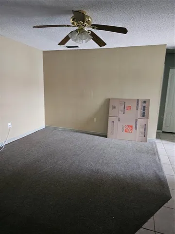 a view of a refrigerator in a room