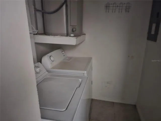 a kitchen with a sink stove and refrigerator