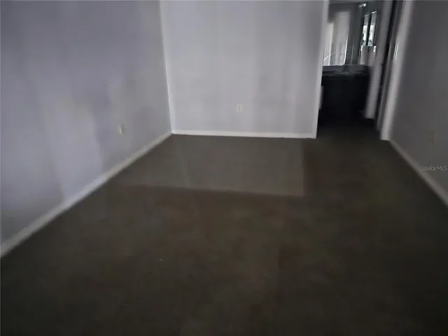 a view of a utility room with windows