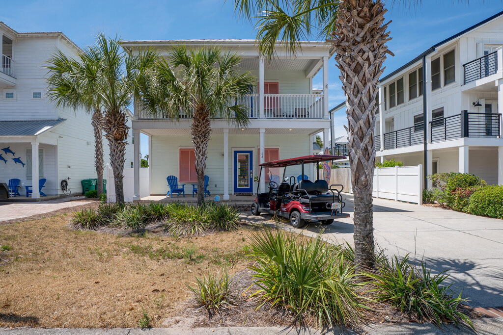 64 Dolphin Street Destin, FL 32541 - Photo 20 of 107 a view of a house with backyard and sitting area