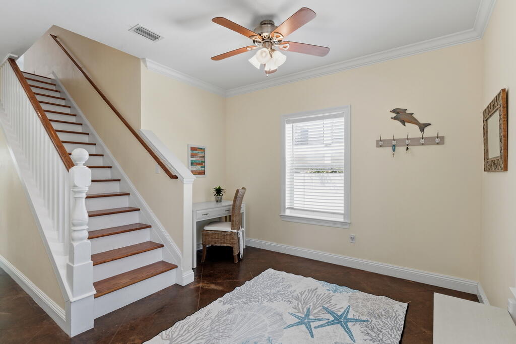 64 Dolphin Street Destin, FL 32541 - Photo 28 of 107 a view of an empty room with a window and a ceiling fan