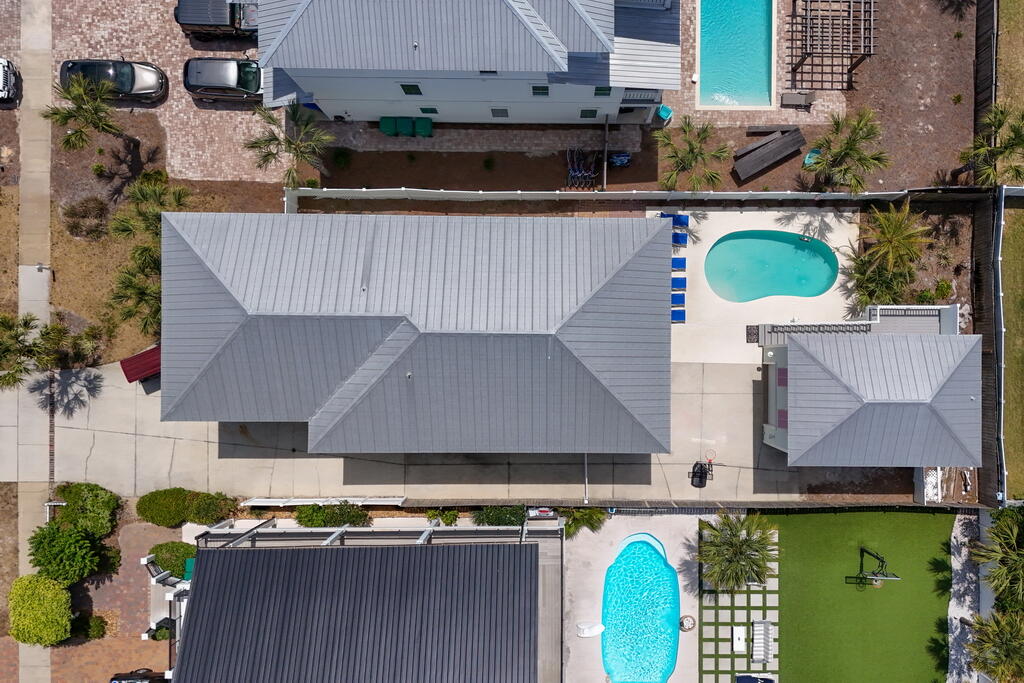 64 Dolphin Street Destin, FL 32541 - Photo 3 of 107 an aerial view of a house with a swimming pool and outdoor space