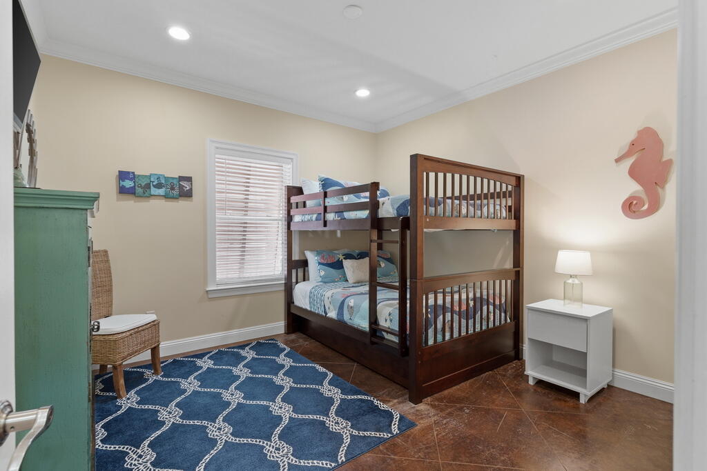 64 Dolphin Street Destin, FL 32541 - Photo 32 of 107 a bedroom with a bed and a window