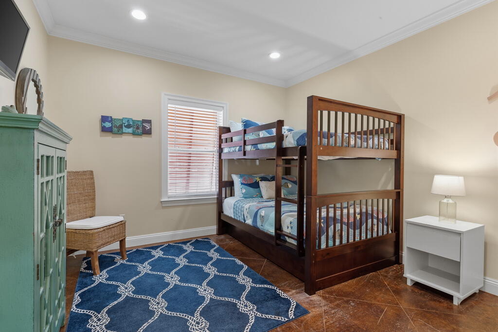 64 Dolphin Street Destin, FL 32541 - Photo 33 of 107 a bedroom with a bed and a window