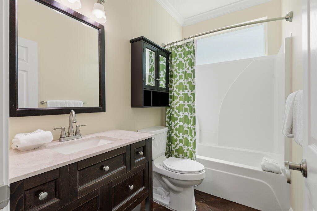 64 Dolphin Street Destin, FL 32541 - Photo 35 of 107 a bathroom with a sink a toilet and shower