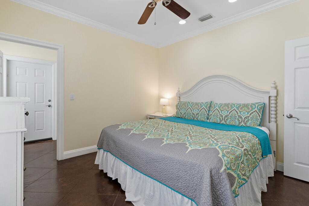 64 Dolphin Street Destin, FL 32541 - Photo 38 of 107 a bed sitting in a bedroom next to a window