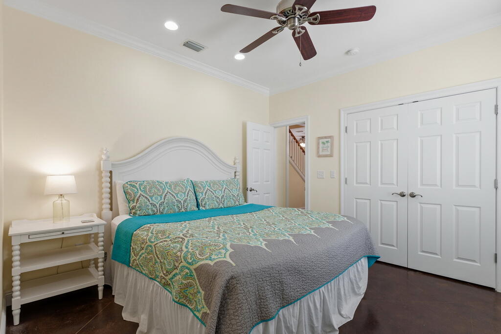 64 Dolphin Street Destin, FL 32541 - Photo 39 of 107 a bedroom with a bed and cabinet