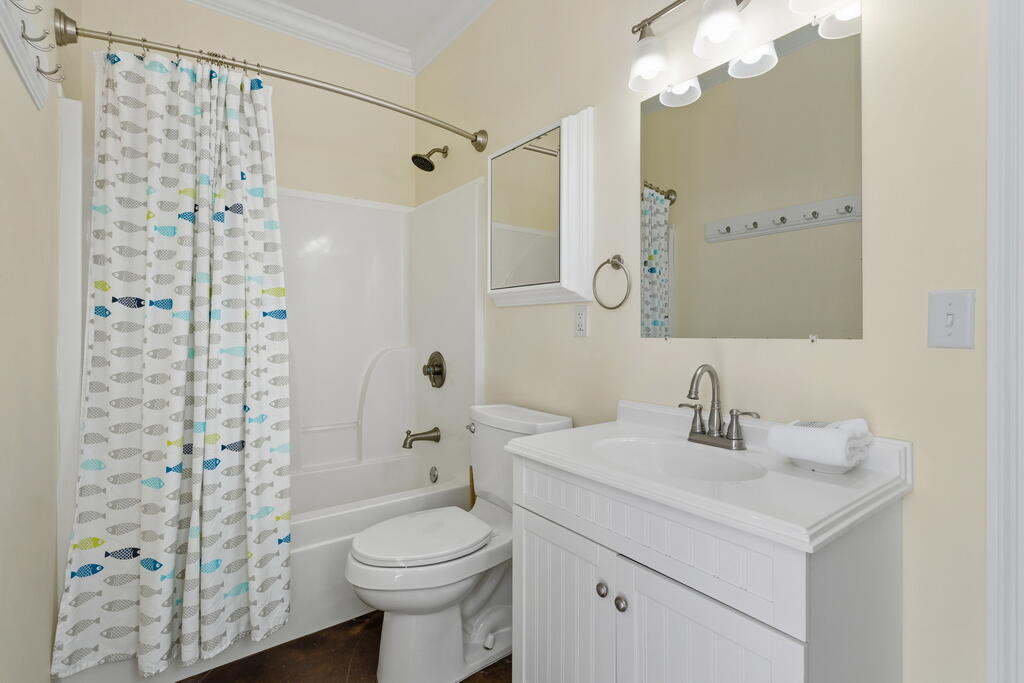 64 Dolphin Street Destin, FL 32541 - Photo 40 of 107 a bathroom with a sink a toilet and shower