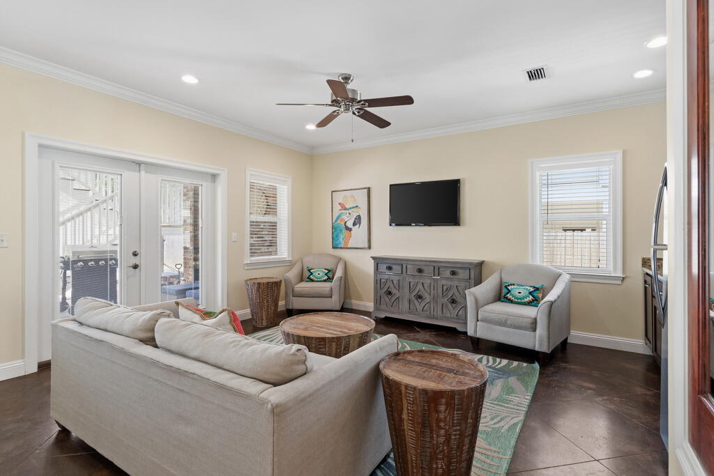 64 Dolphin Street Destin, FL 32541 - Photo 41 of 107 a living room with furniture and a flat screen tv