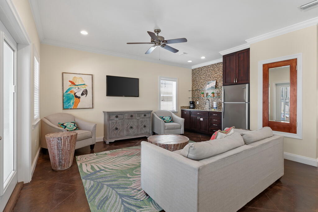 64 Dolphin Street Destin, FL 32541 - Photo 42 of 107 a living room with furniture and a flat screen tv