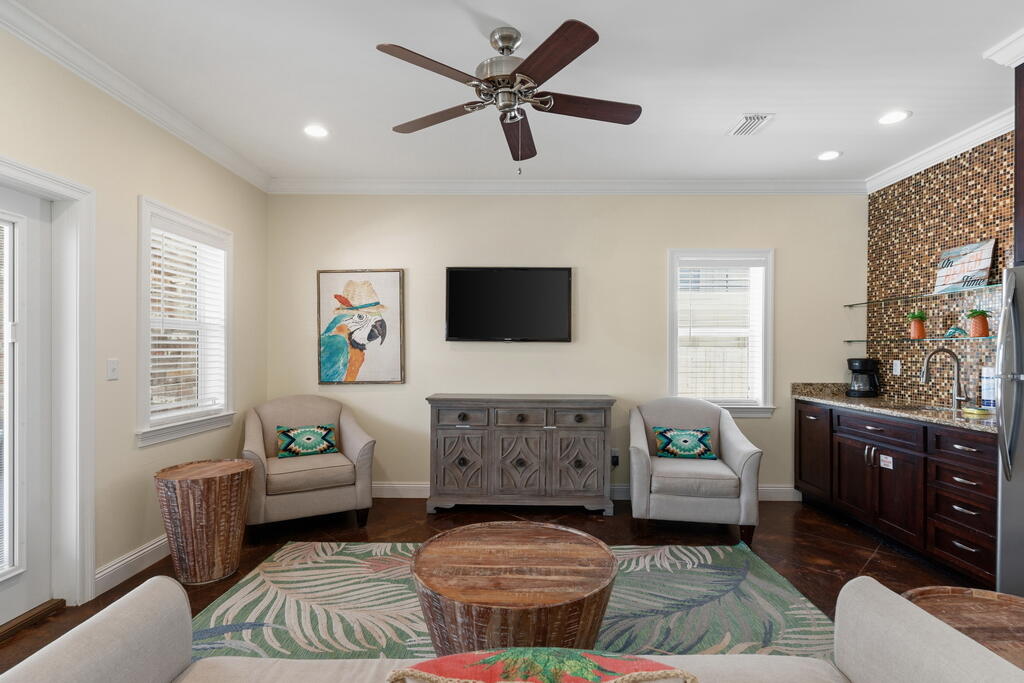64 Dolphin Street Destin, FL 32541 - Photo 47 of 107 a living room with furniture and a flat screen tv