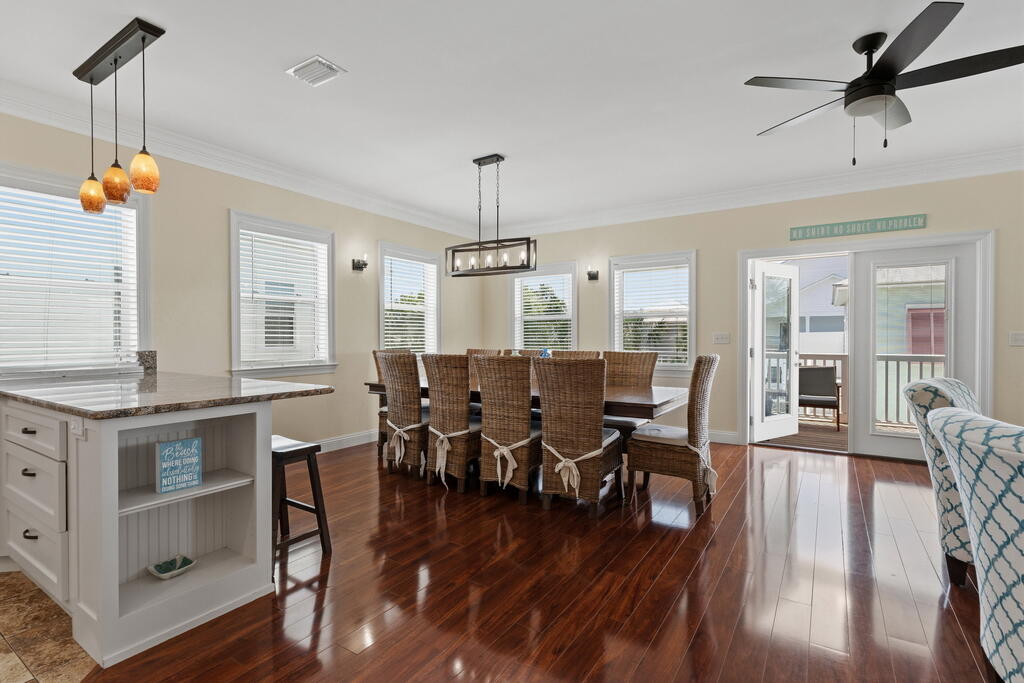 64 Dolphin Street Destin, FL 32541 - Photo 49 of 107 a view of a dining room with furniture window and wooden floor