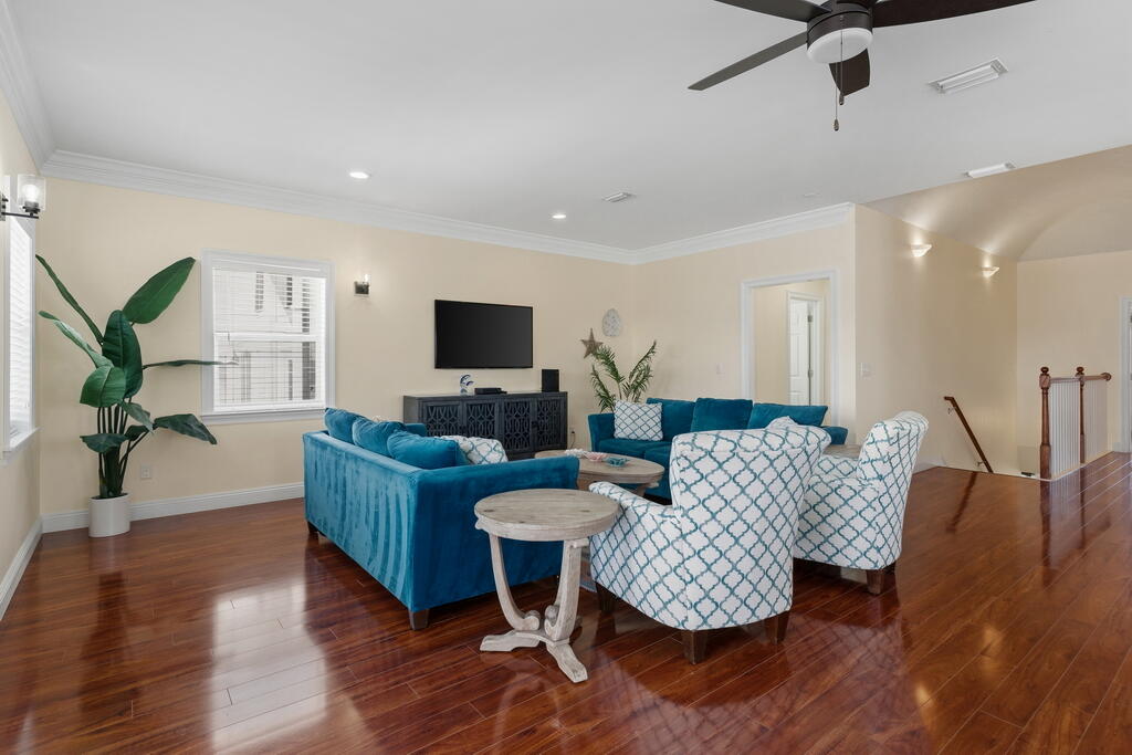 64 Dolphin Street Destin, FL 32541 - Photo 57 of 107 a living room with furniture and a flat screen tv