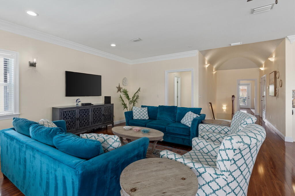64 Dolphin Street Destin, FL 32541 - Photo 58 of 107 a living room with furniture and a flat screen tv