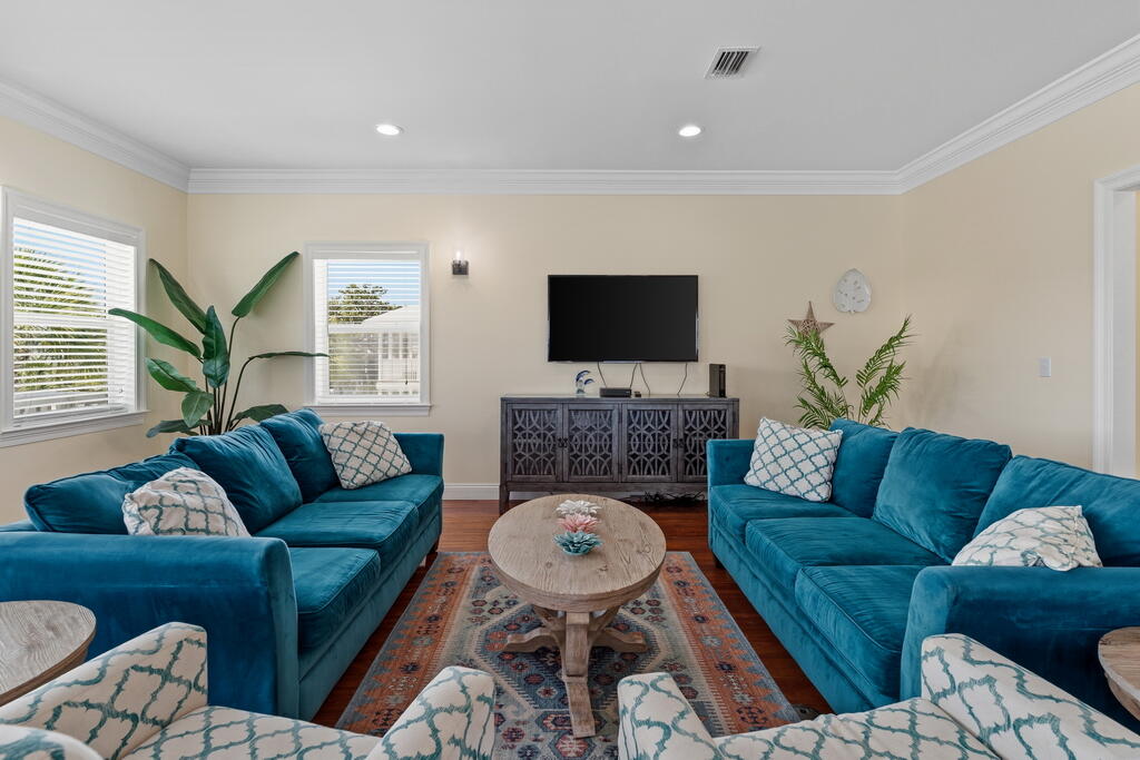 64 Dolphin Street Destin, FL 32541 - Photo 59 of 107 a living room with furniture and a flat screen tv